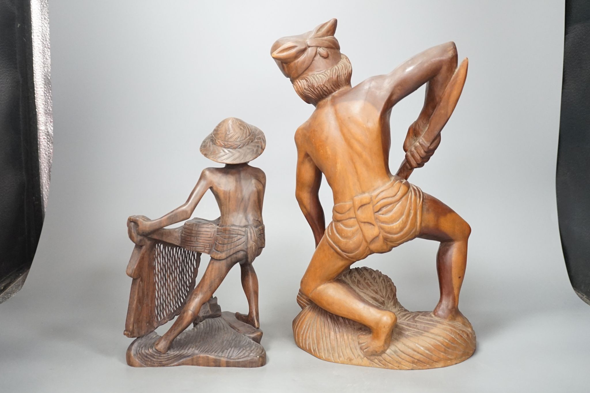 Two southeast Asian figural hardwood carvings 35cm